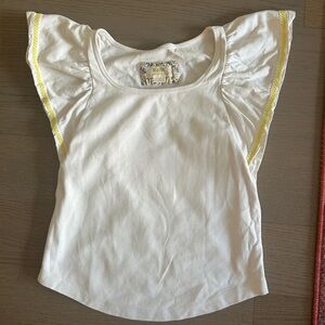 Cute white short sleeved top with yellow stitching on sleeves